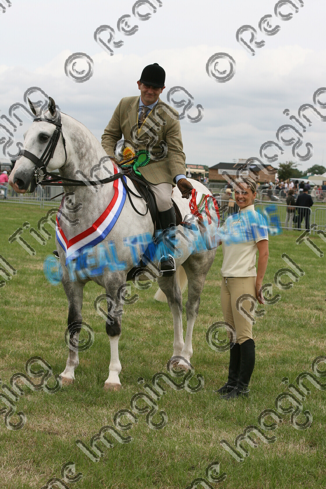 S07-30-3-172 
 Keywords: 178, BILLY WHIZZ III, Amateur, Cob, Championship, Champion, winner win won, `Owner: , `Rider: , Richard Holt, June 2007, Cheshire County Show, Tabley, Knutsford, Cheshire, dappled grey gray, Presented By: , Sue Hinchcliffe, Rosette, trophy, presentation, stand, upright portrait, sash, horse pony, Lightweight, Ridden
