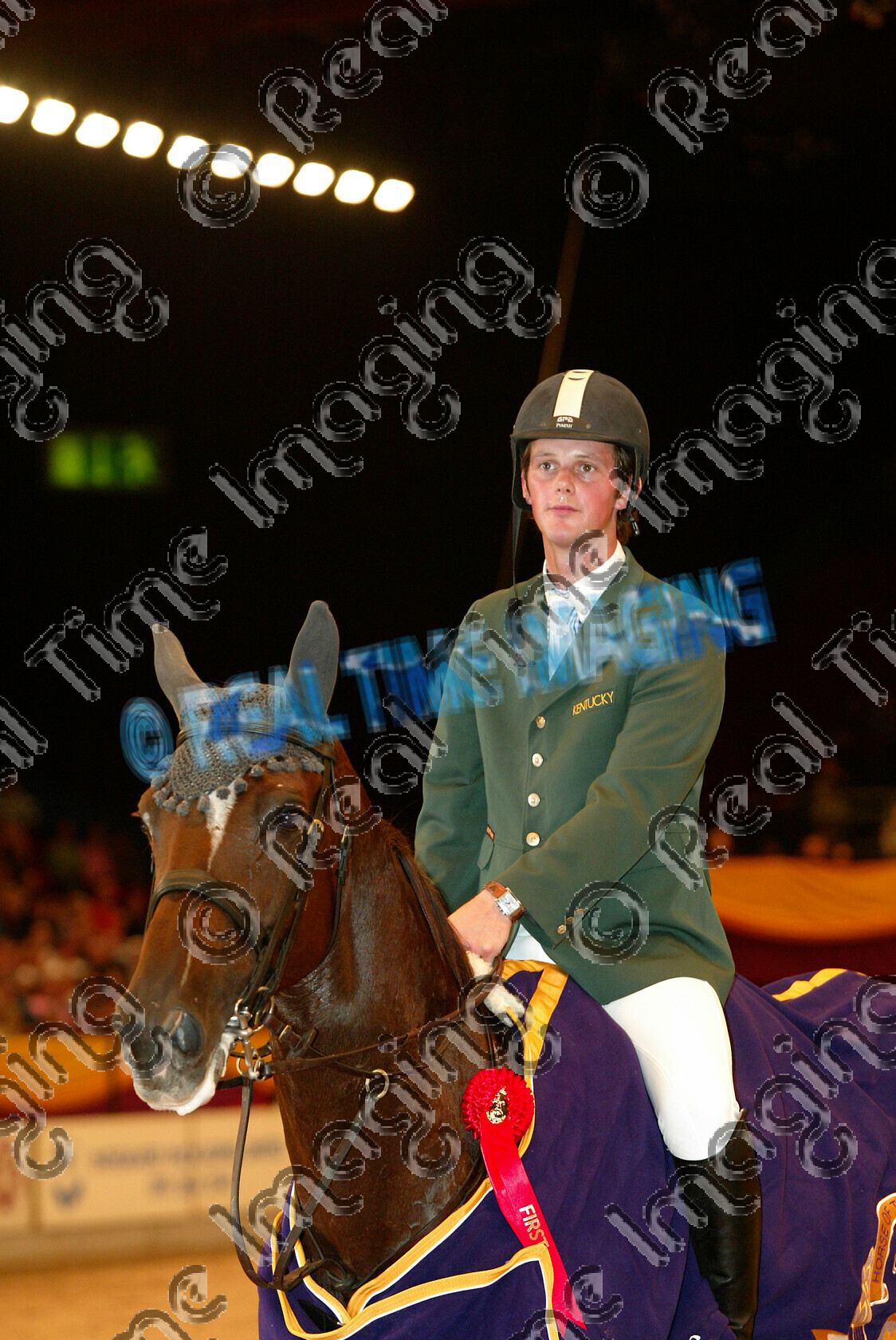 S05-67-T7-061 
 HOYS 2005: The Zinc Management Cup winner 
 Keywords: horse of the year show 2005 05 hoys saturday 15 10 october 21 Zinc Management Cup winner 95 Intermission Billy Twomey chestnut mare standing presentation rug trophy rosette showjumping showjumper