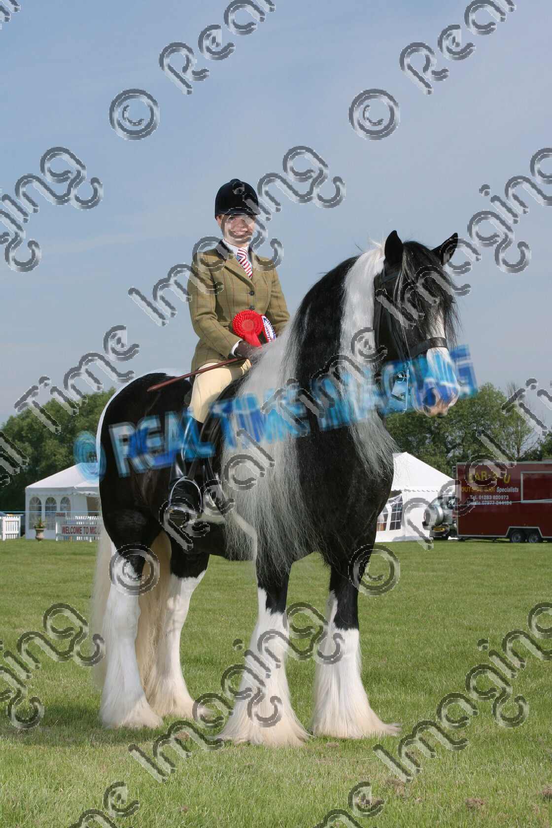 S07-28-01-016 
 Keywords: 710 JASPER BAILEY CHAPS (UK) Ridden Coloured Championship Champion winner win won Owner: Rider: Kirsty Ahern stand coloured colored paint piebald Gelding 3 June 2007 Midland Counties Show Uttoxeter Racecourse upright portrait traditional long mane horse pony Rosette feather