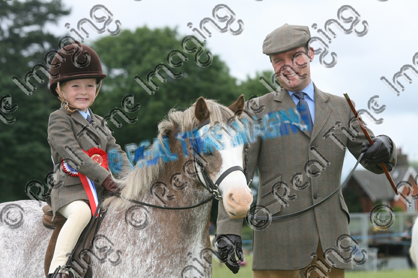 L07-04-01-074 
 Keywords: Derbyshire County Show, Elvaston, Derby, UK, 24 June 2007, 164, BRYNTOWY SPICE GIRL, NPS, Mini, Mountain and Moorland M&M, Championship, Champion, winner win won, `Owner: , Blythe, Mrs S, `Rider: , Joshua Blythe, chestnut, roan, close up, stand, presentation, view landscape, Rosette, child rider, horse pony, sport