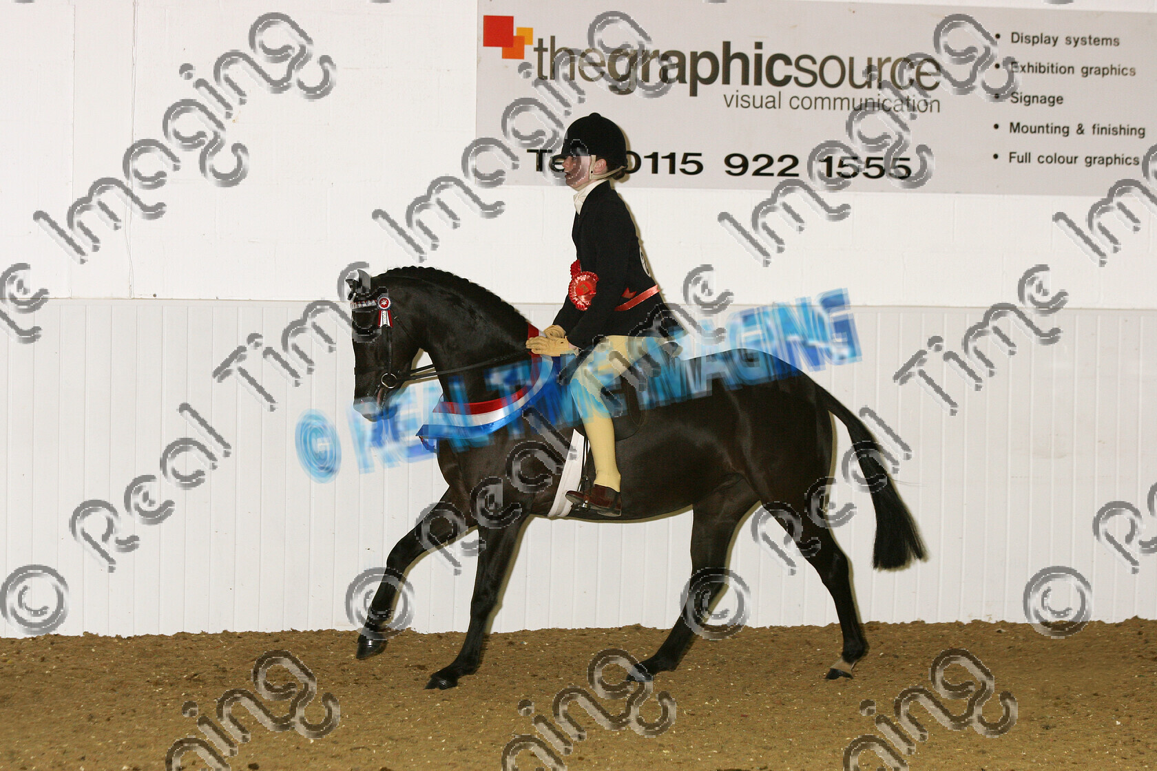 S07-14-15-324 
 Keywords: BSPS Winter Championship Show April 2007 Arena UK winner champion first place top placed Winter Novice Show Pony Champion 232: PENNYMORE ISADORA O: Sir frank Barlow R: Lizzie Smith black mare rosette rosettes sash sashes canter cantering action moving flat lap of honour